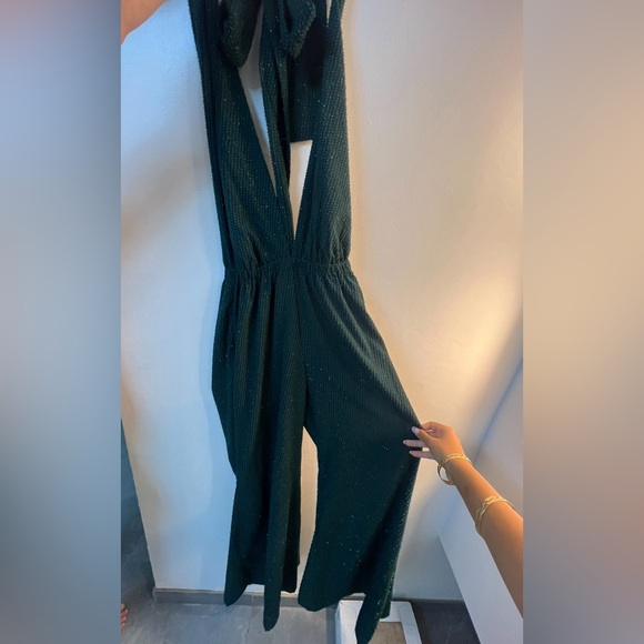Jumpsuit. Worn once. Back is opened and it’s a tie around neck. - Picture 2 of 2